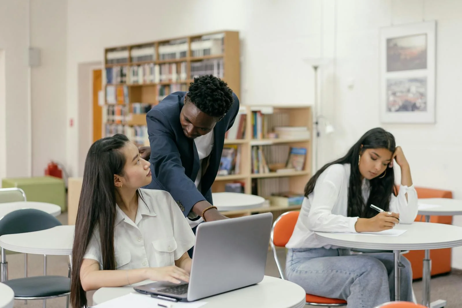 Educator supporting students during a learning session.